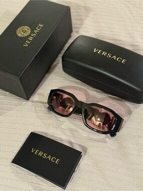 Versace Women’s Black Frame Sunglasses with Pink Lenses